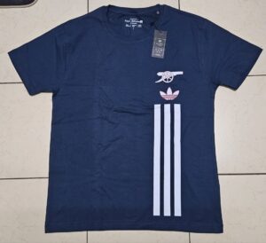 Navy shirt with Arsenal cannon logo, Adidas trefoil, and three vertical stripes.