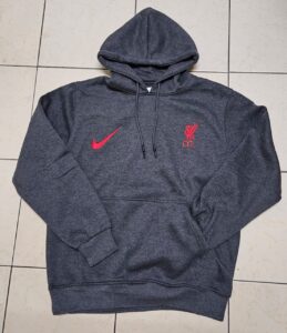 Dark gray Nike hoodie with embroidered red swoosh and Liverpool FC Liverbird crest with L.F.C. text, official sports merchandise featuring front pocket and hood drawstrings.