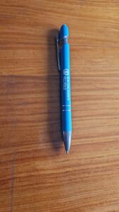 Blue metallic pen printed with SOS Children’s Villages logo, promotional stationery item for custom branding.